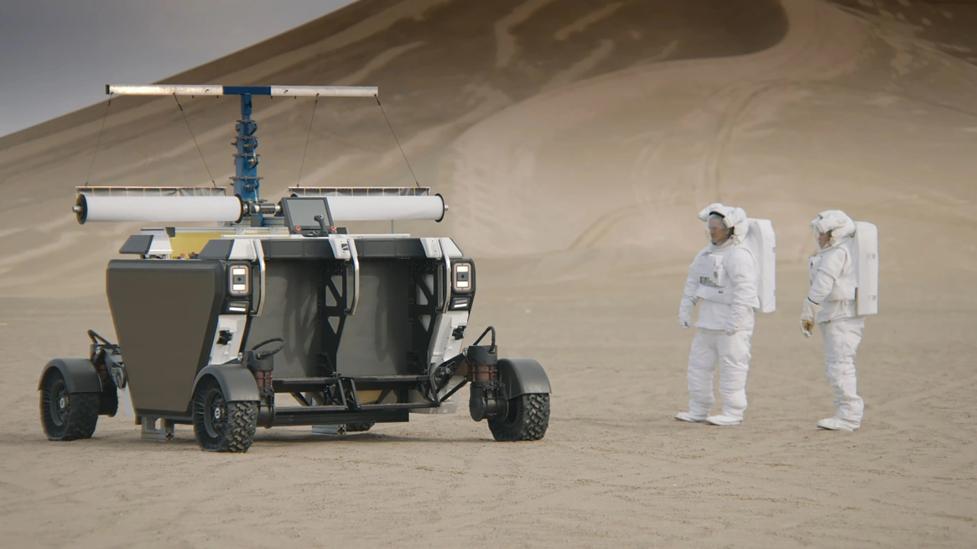 flex-rover-next-to-astronauts.webp