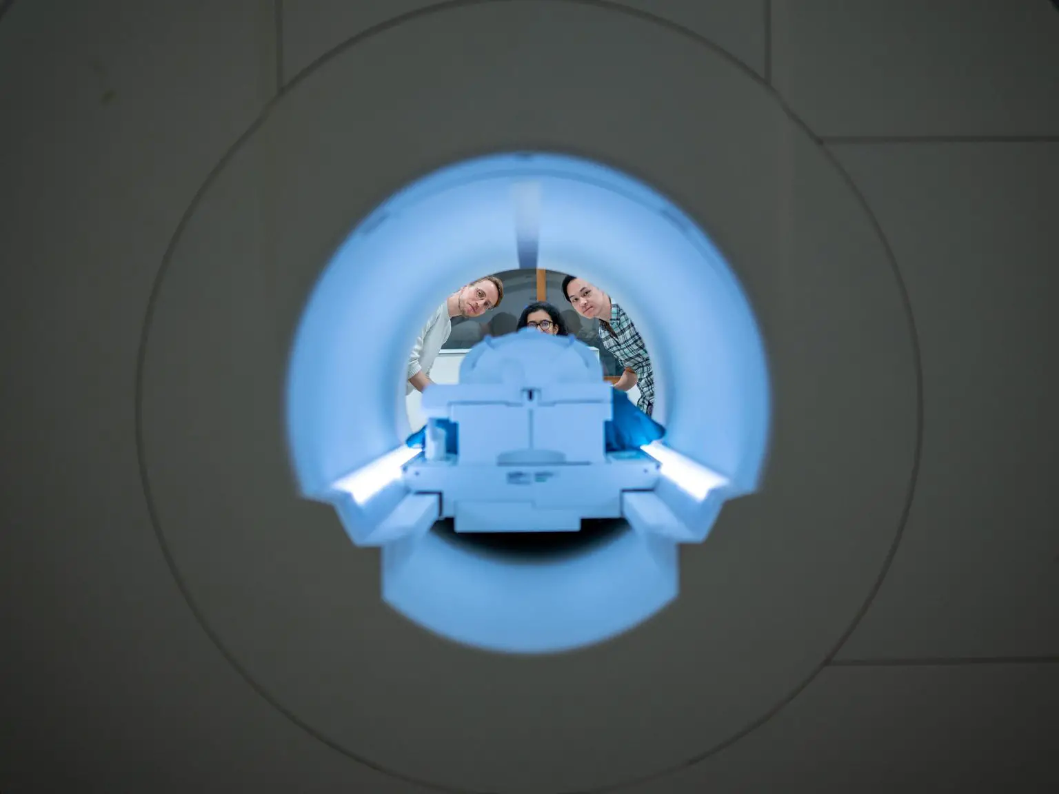 Scientists-Peer-Through-fMRI-Scanner-1536x1152.webp