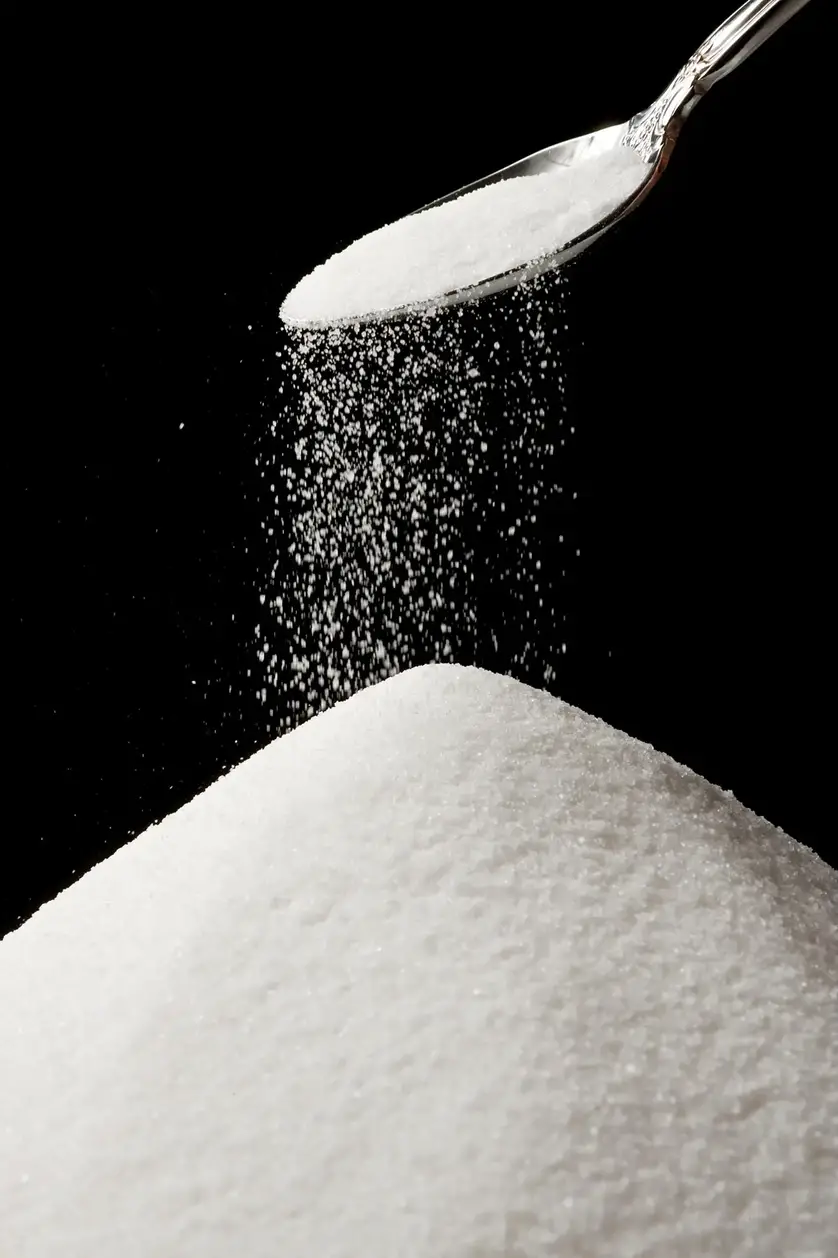 Sprinkling-Sugar-From-Spoon.webp