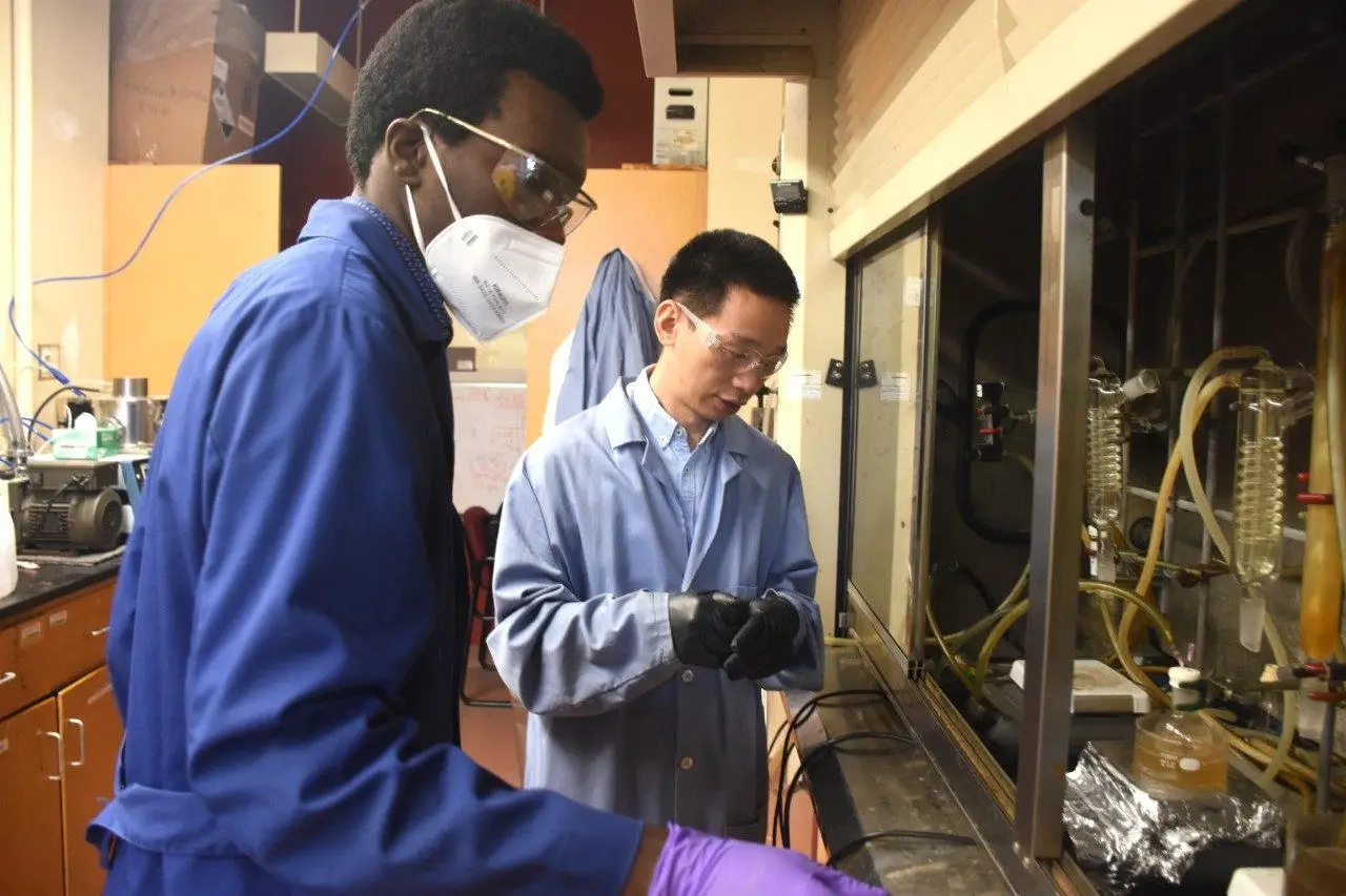Eric-Munyaneza-and-Guoliang-Liu.webp