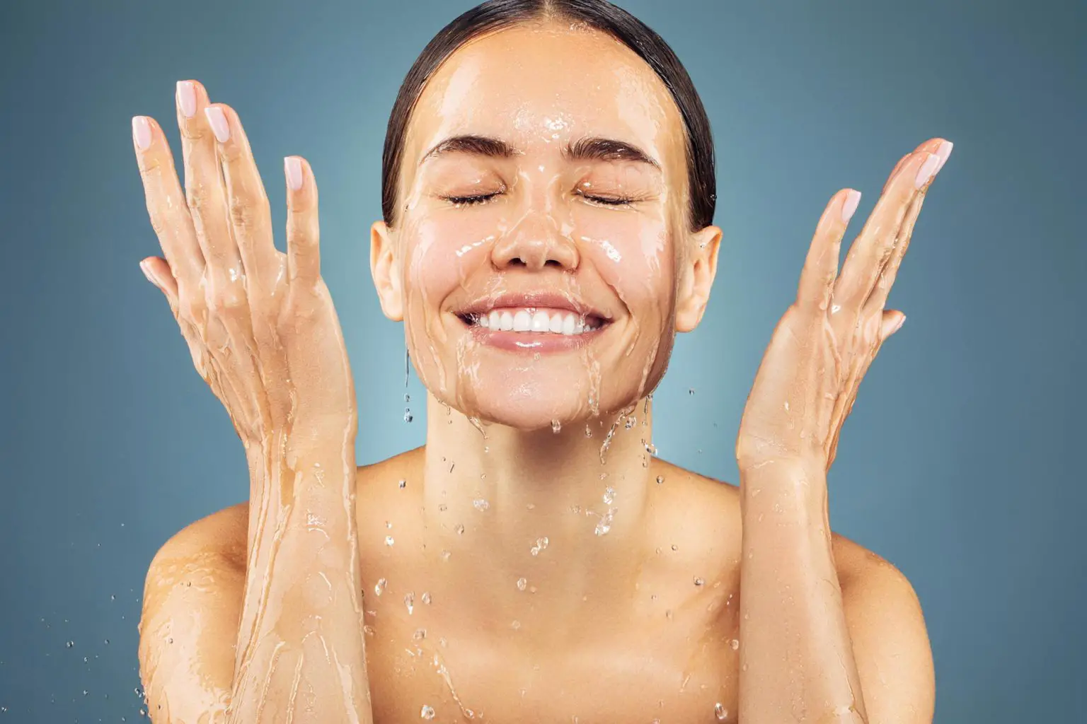 Young-Woman-Washing-Face-Smiling-1536x1024.webp