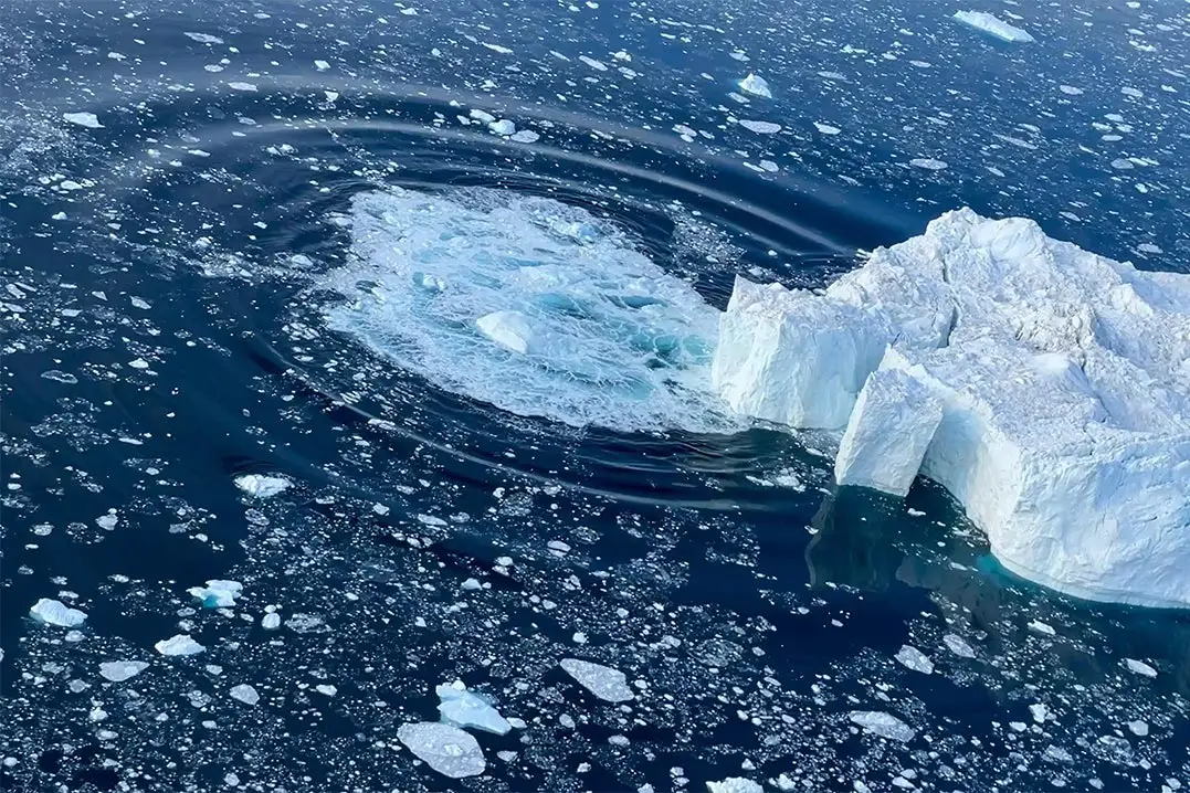 Circular-Wave-Ice-Falling-off-Iceberg.webp