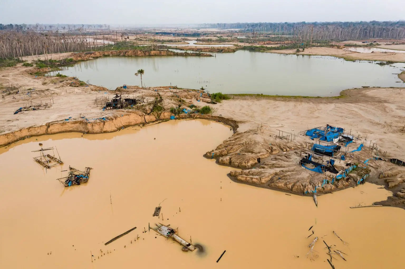 Mining-Equipment-in-La-Pampa-Region-of-Madre-De-Dios-Peru-1536x1023.webp