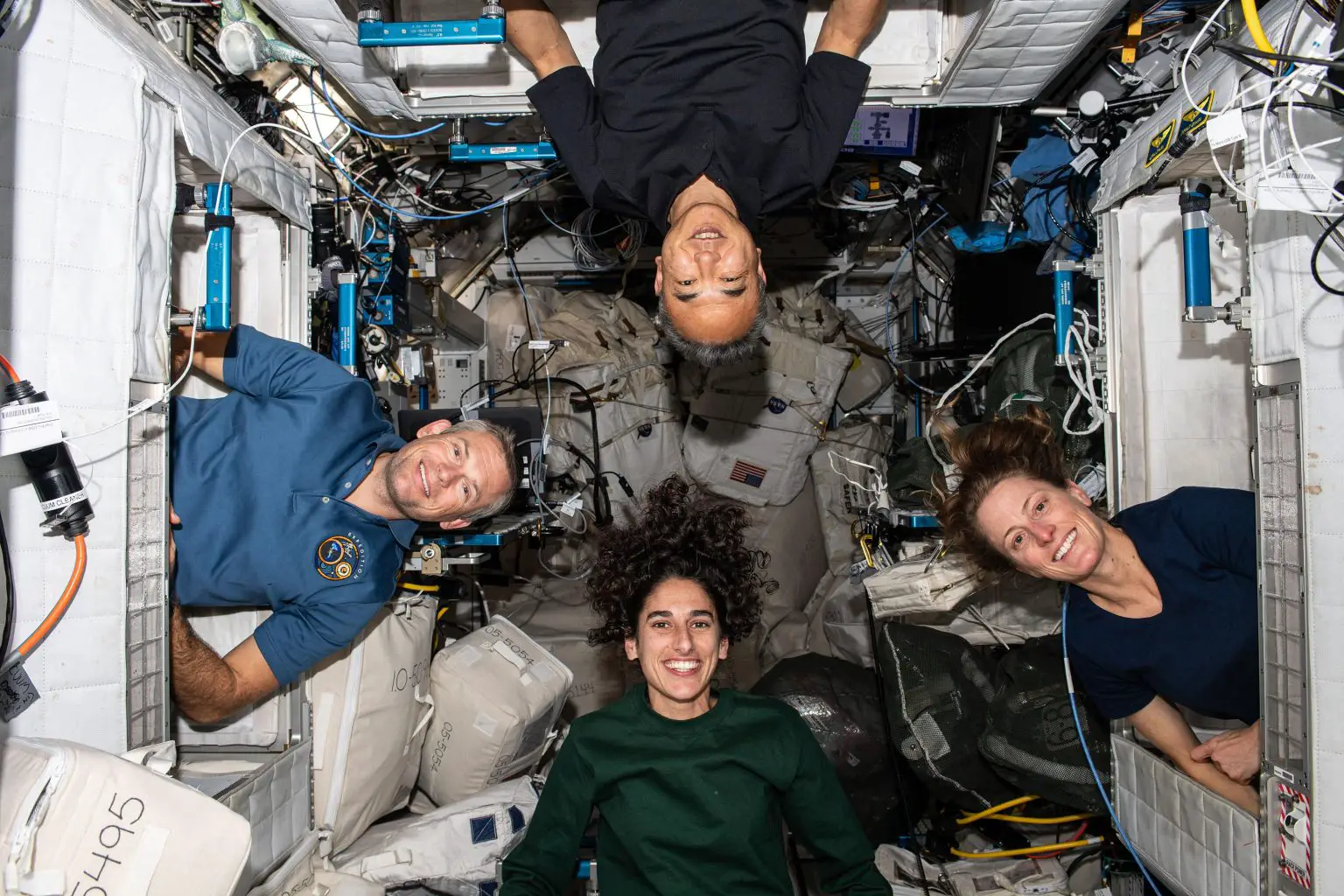 Expedition-70-Astronauts-Pose-Portrait-Inside-Crew-Quarters-1536x1024.webp