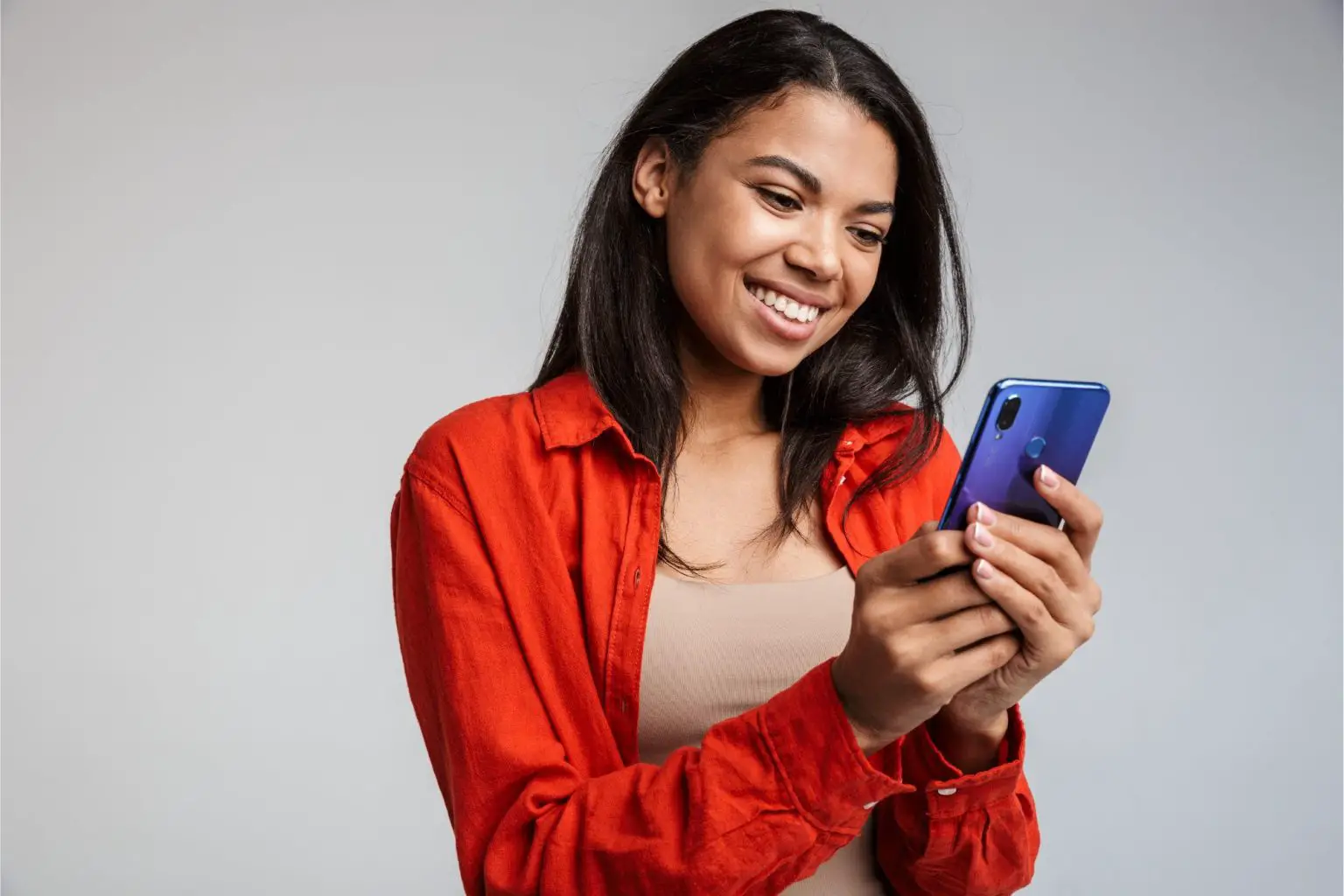 Smiling-Woman-on-Phone-1536x1024.webp