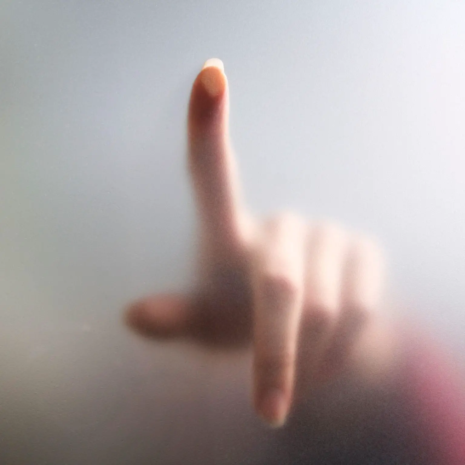 Fingertip-Touches-Fogged-Glass-1536x1536.webp