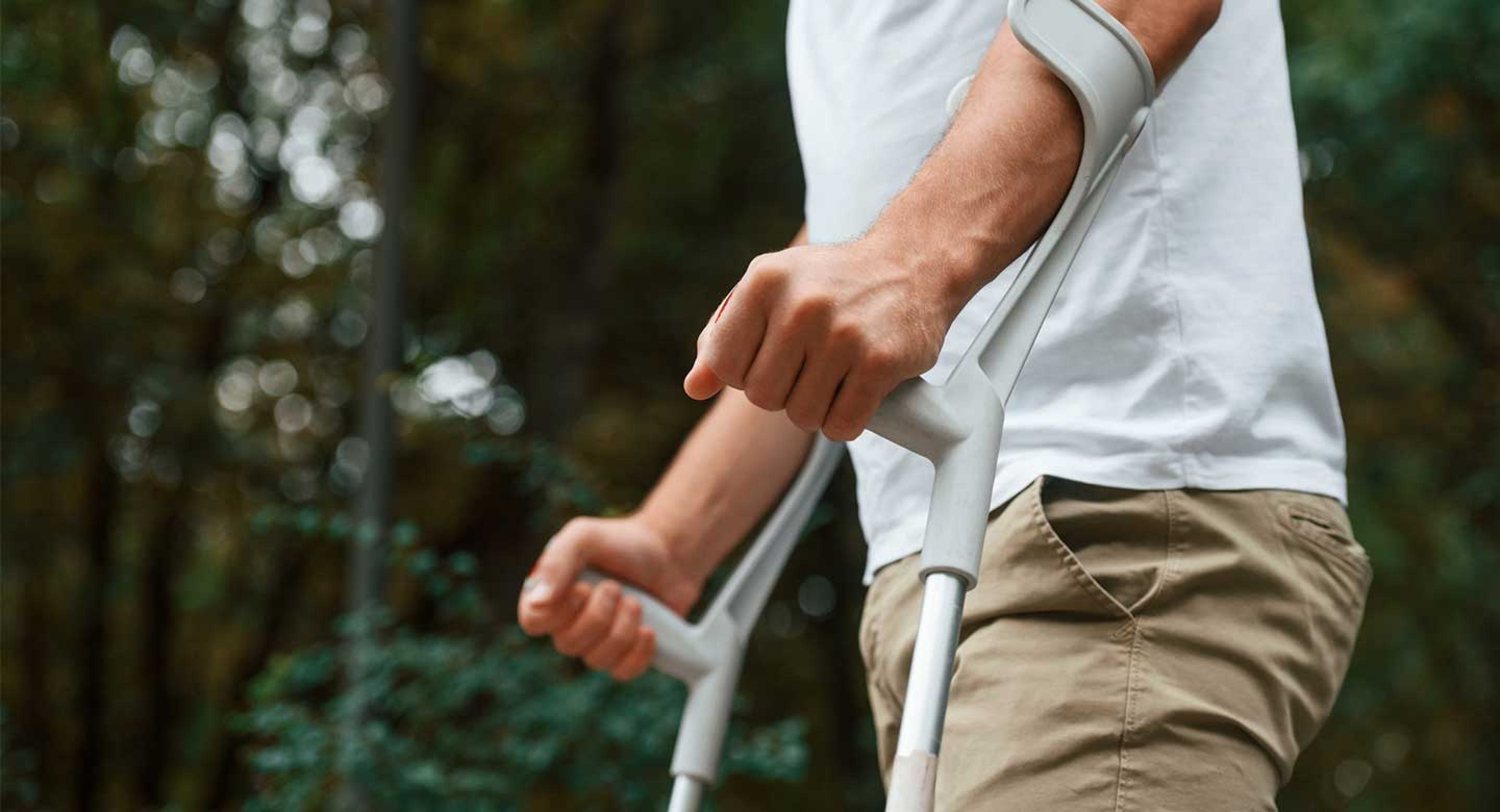 man-using-crutches-multiple-sclerosis.jpg