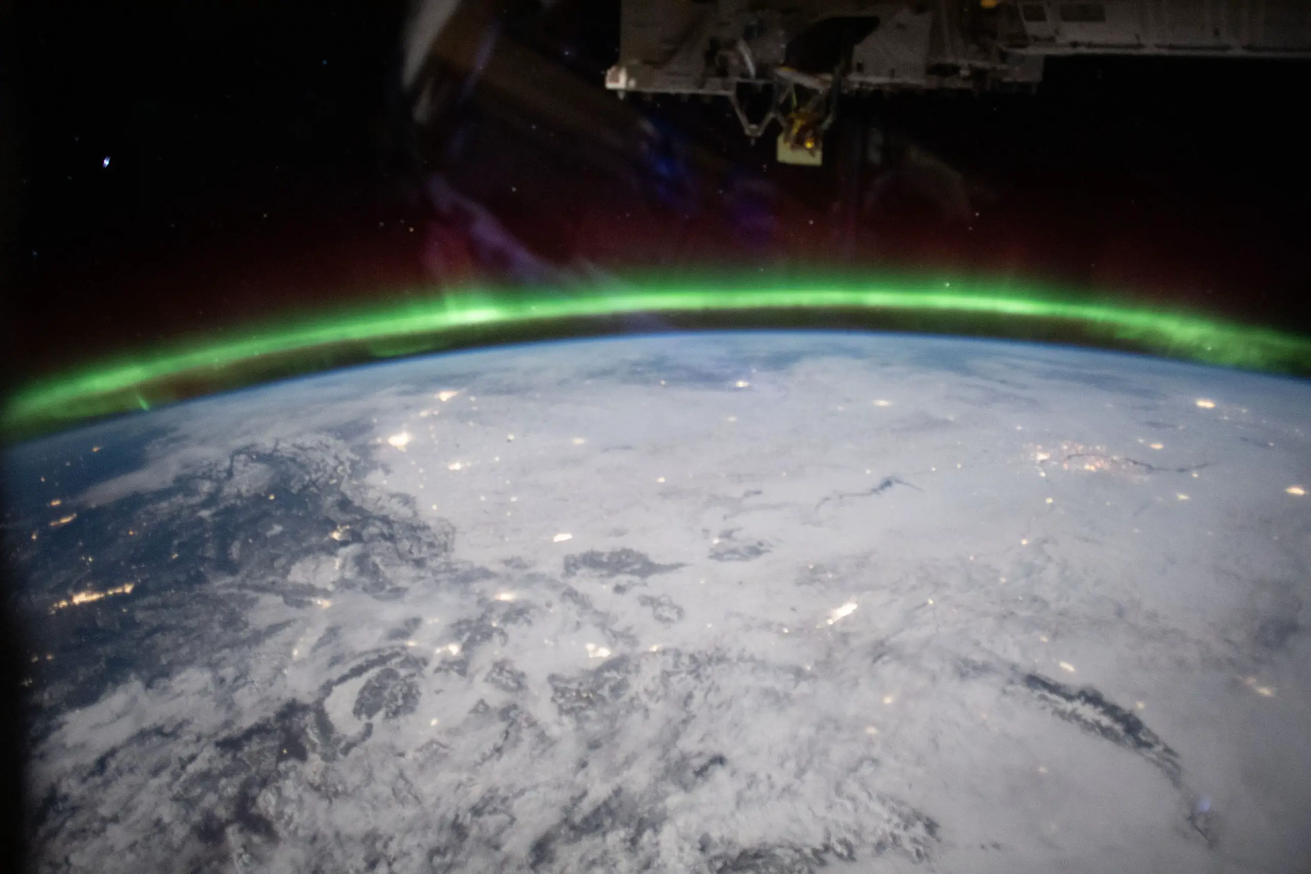 Aurora-Glows-Above-Earth-scaled.webp
