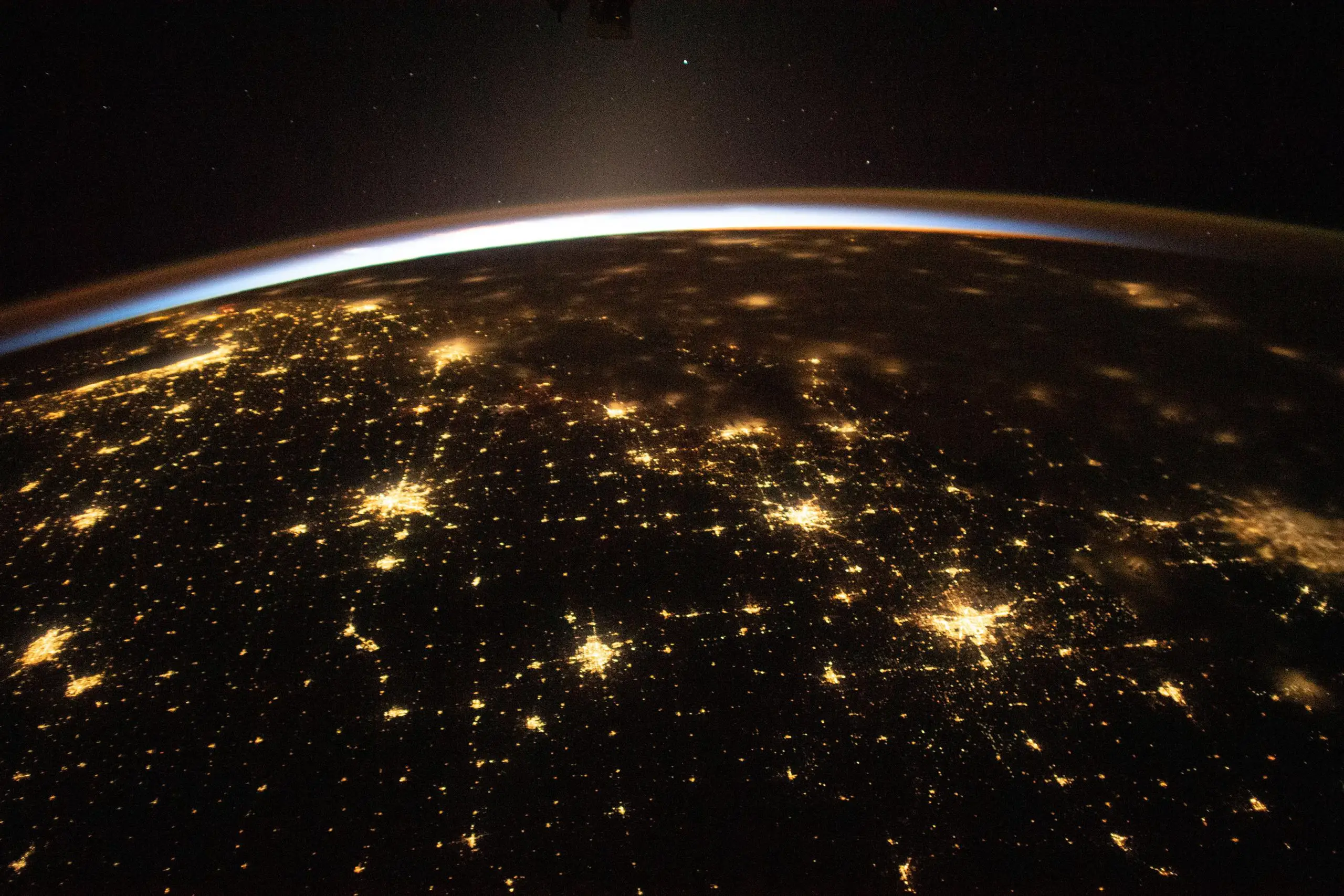 Suns-First-Rays-and-the-City-Lights-of-US-scaled.webp