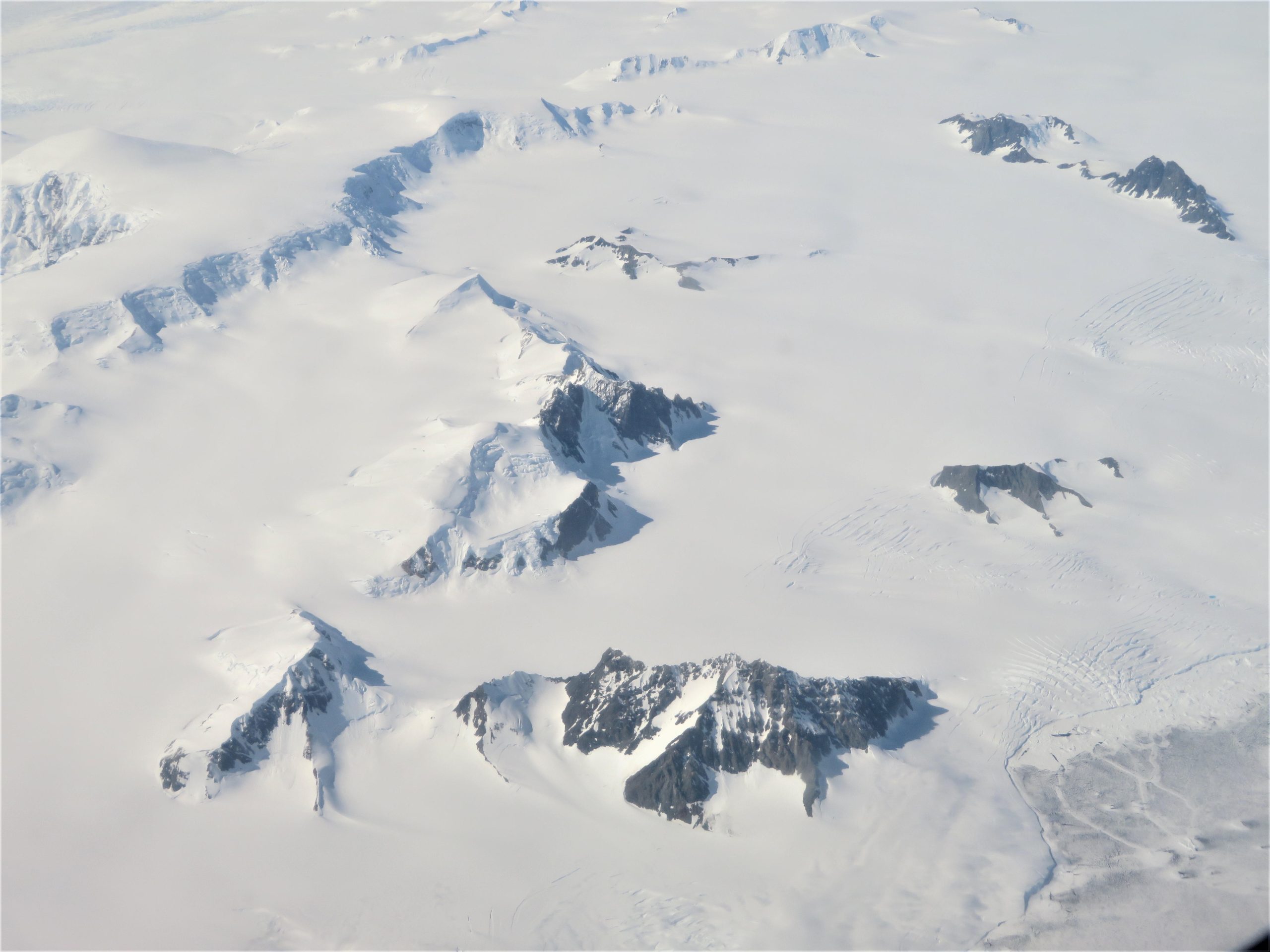 Mountains-and-Glaciers-of-the-Antarctic-Peninsula-From-Above-scaled.jpg