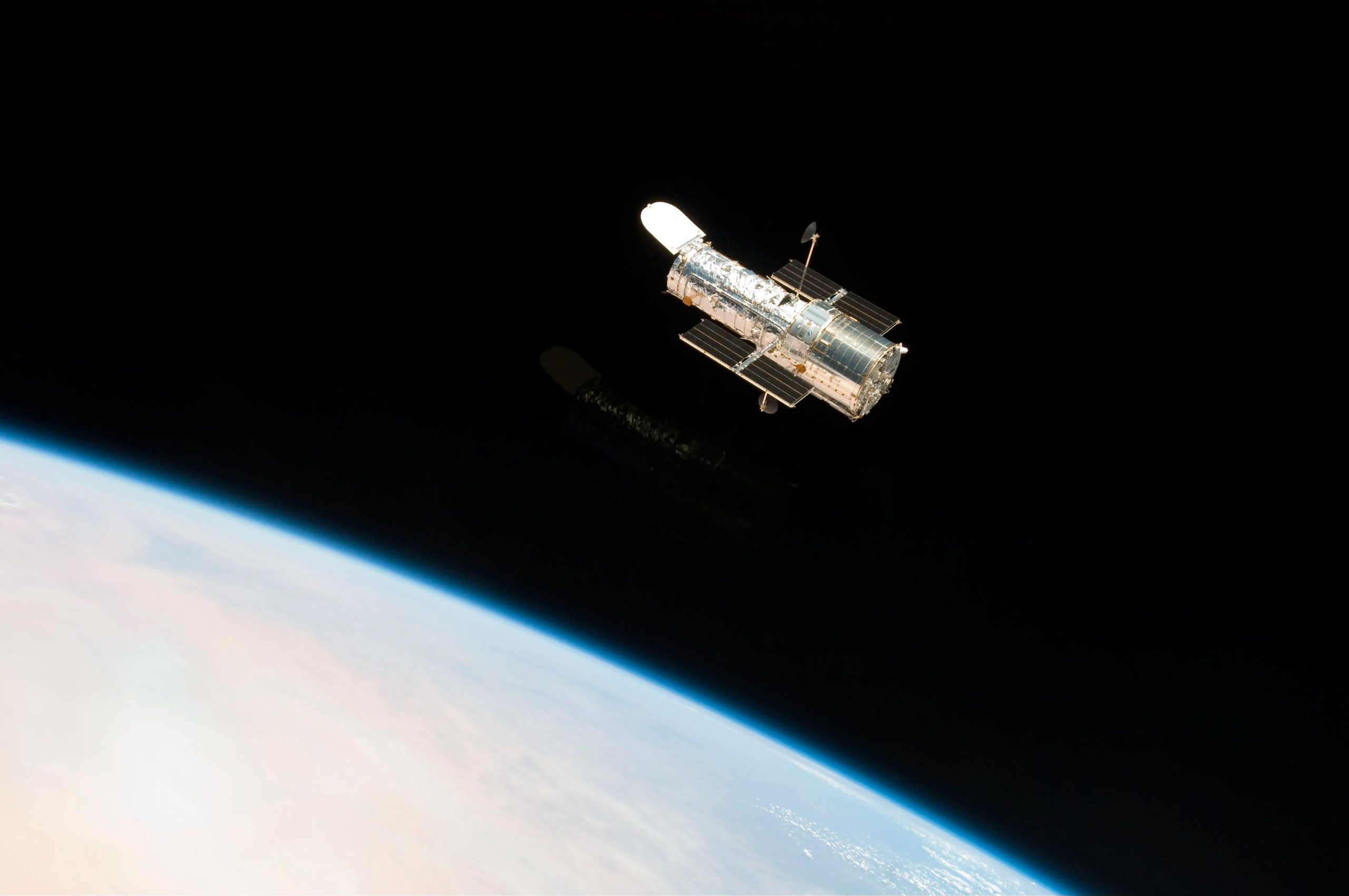 Hubble-Orbiting-Above-Earth-scaled.jpg