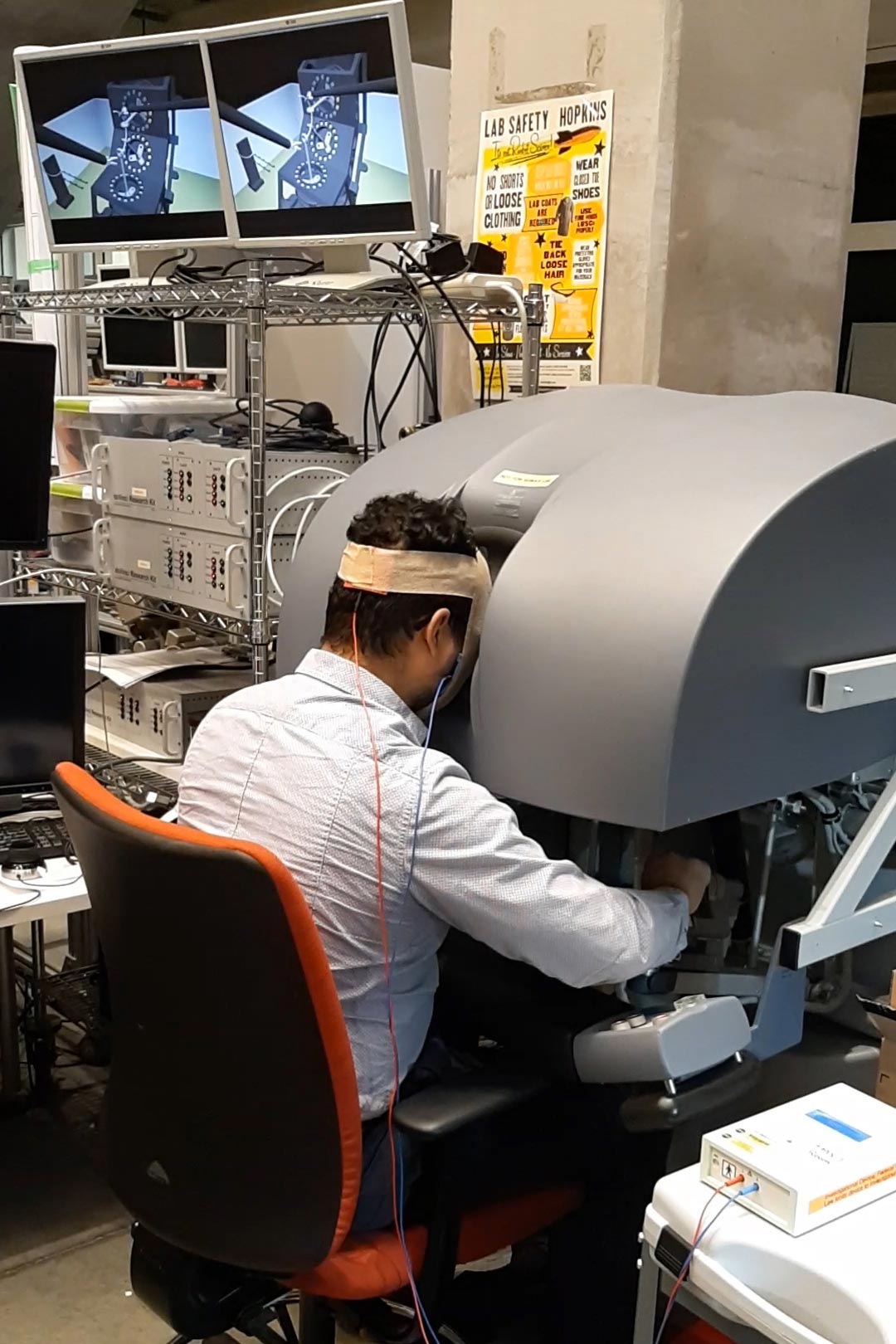 Noninvasive-Brain-Stimulation-at-Surgical-Robot-Console.jpg