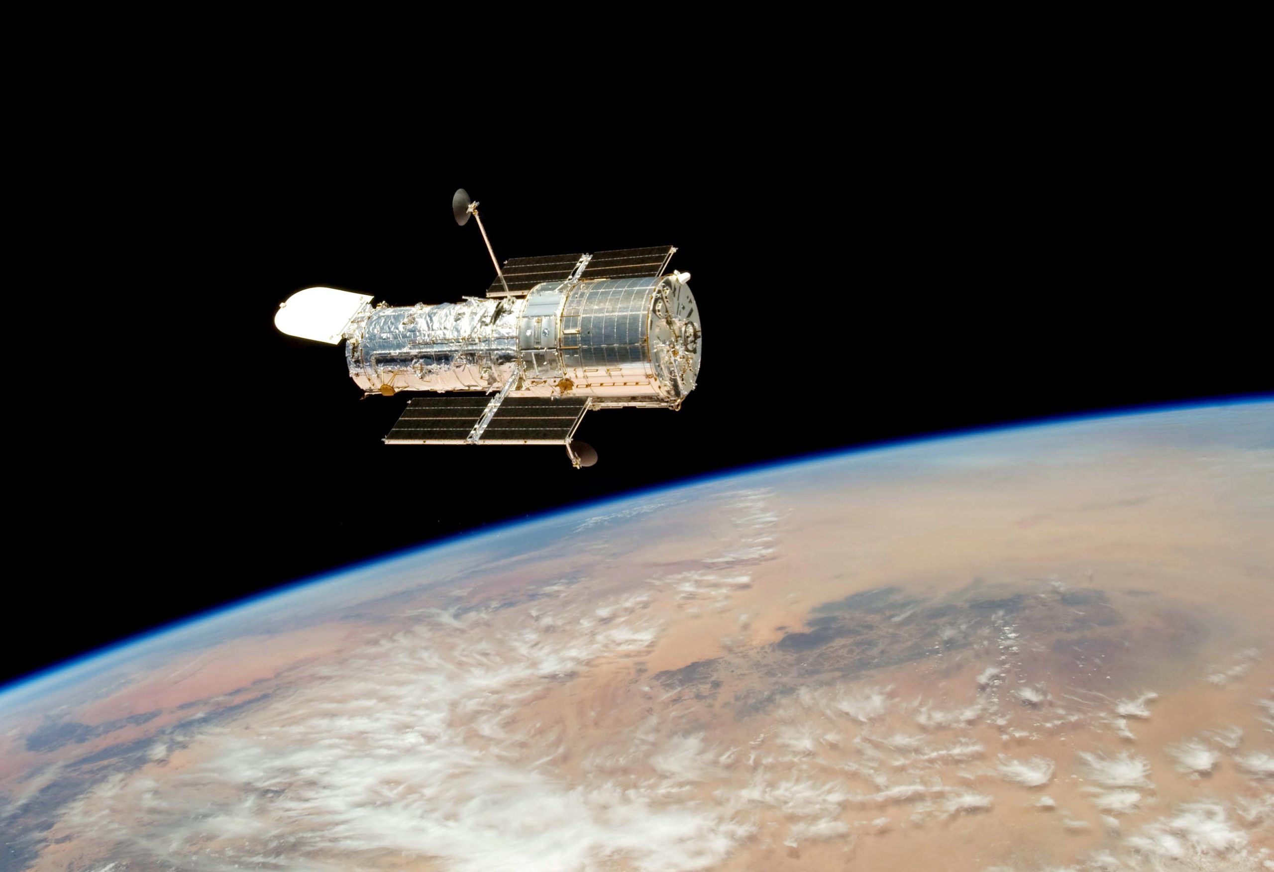 Hubbles-Final-Release-Over-Earth-scaled(1).jpg