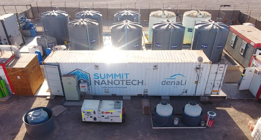 a-large-white-trailer-labelled-summit-nanotech-is-surrounded-outside-by-large-storage-tanks-and-other-equipment.webp