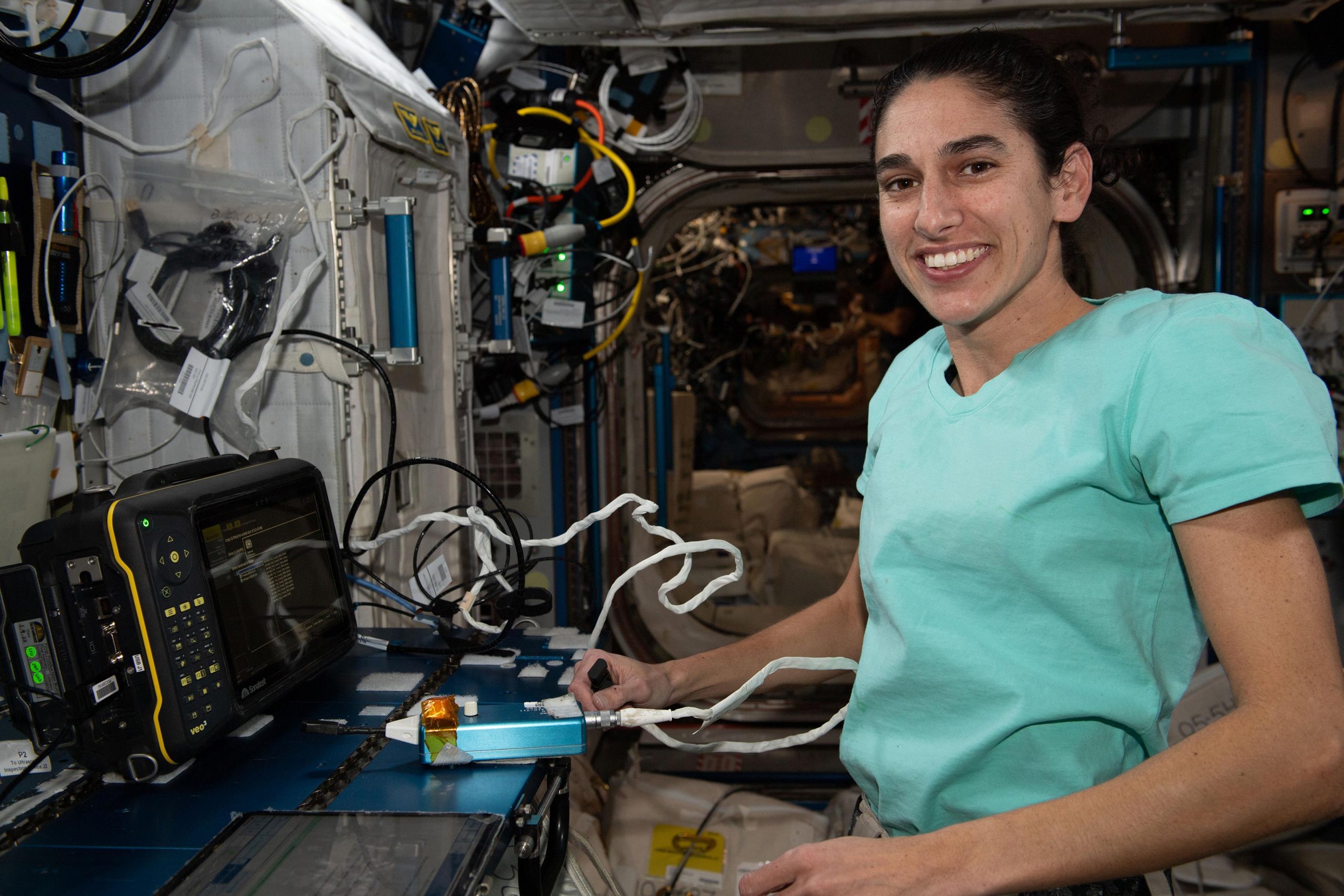 Astronaut-Jasmin-Moghbeli-Calibrates-Ultrasonic-Inspection-Device-scaled.jpg