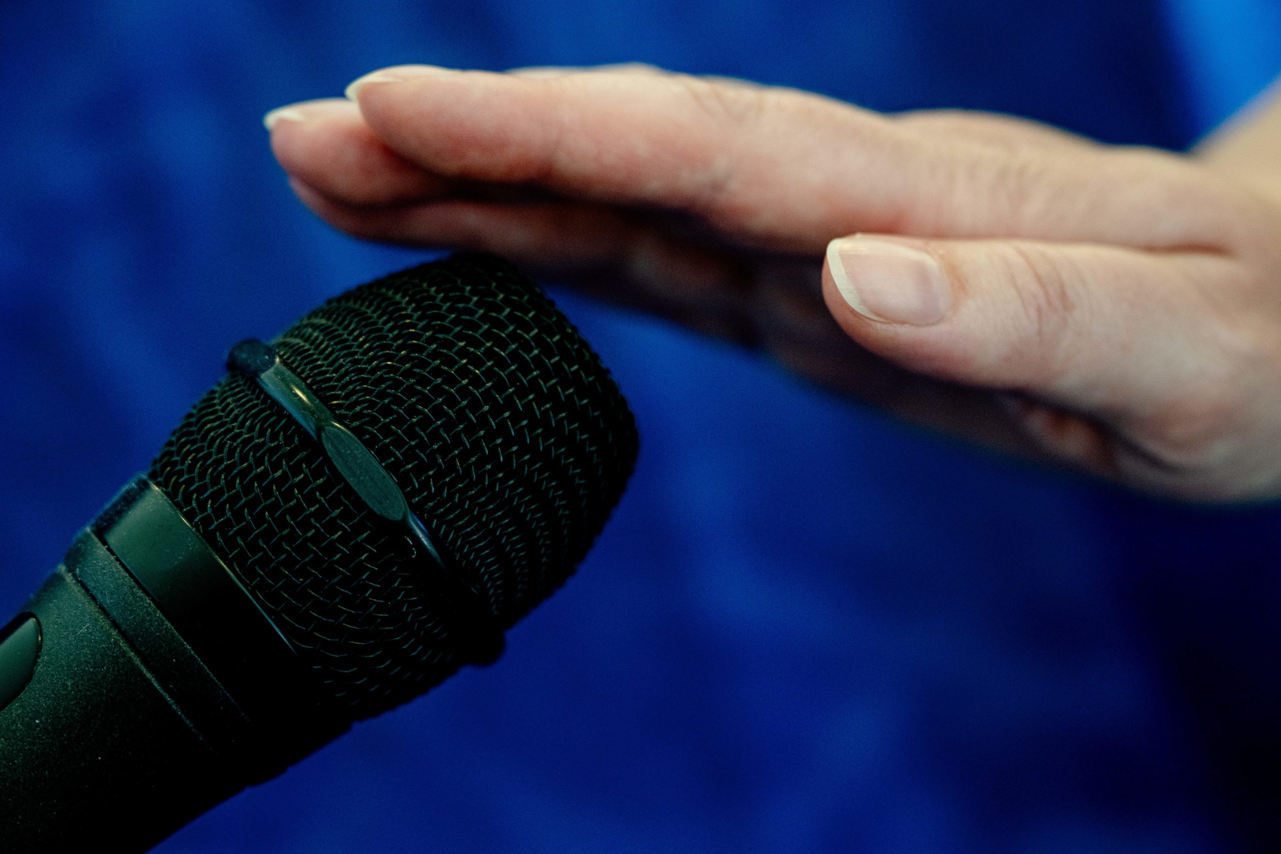 Touching-a-Microphone-scaled.jpg