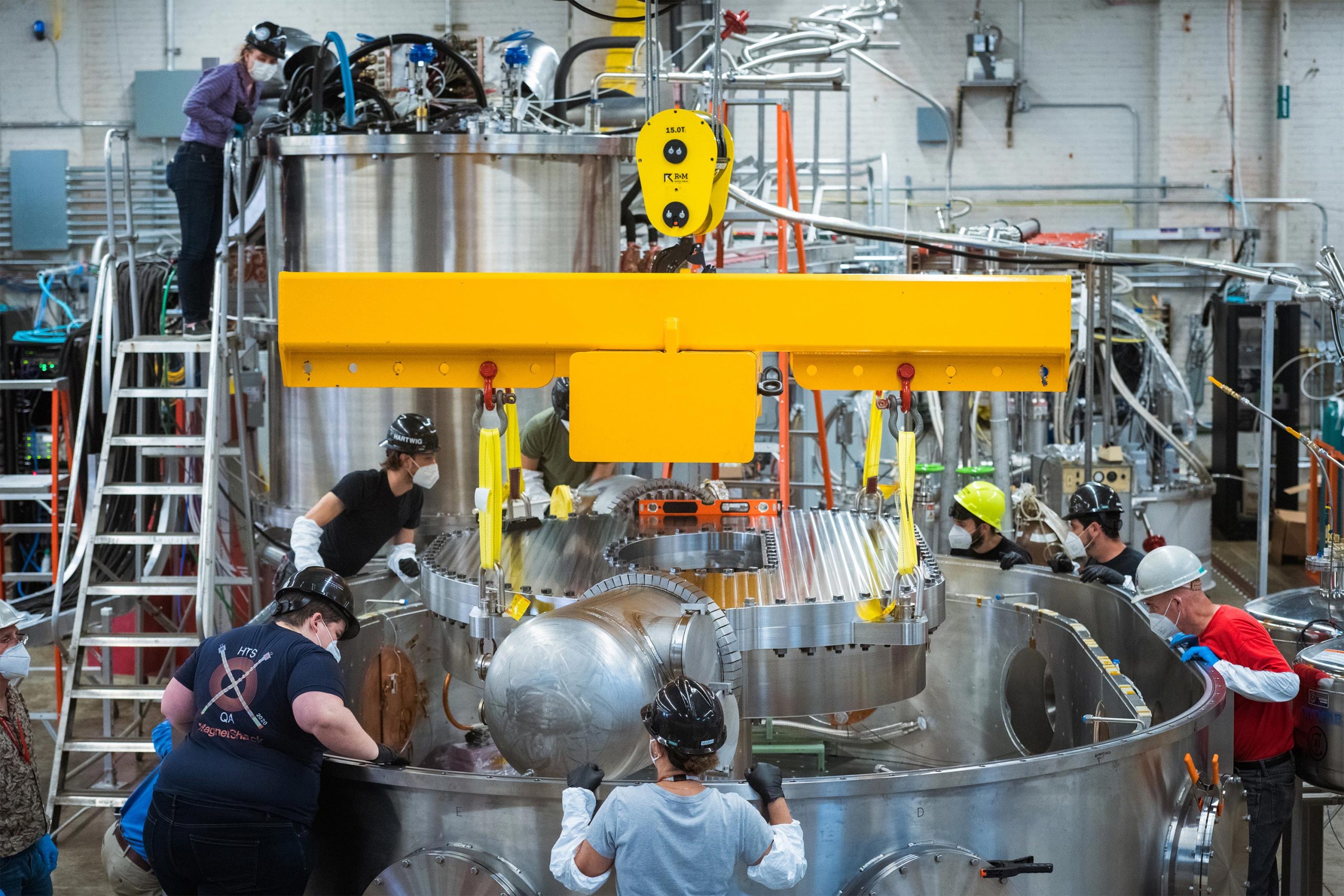 Lowering-Magnet-Into-Cryostat-Container-scaled.jpg