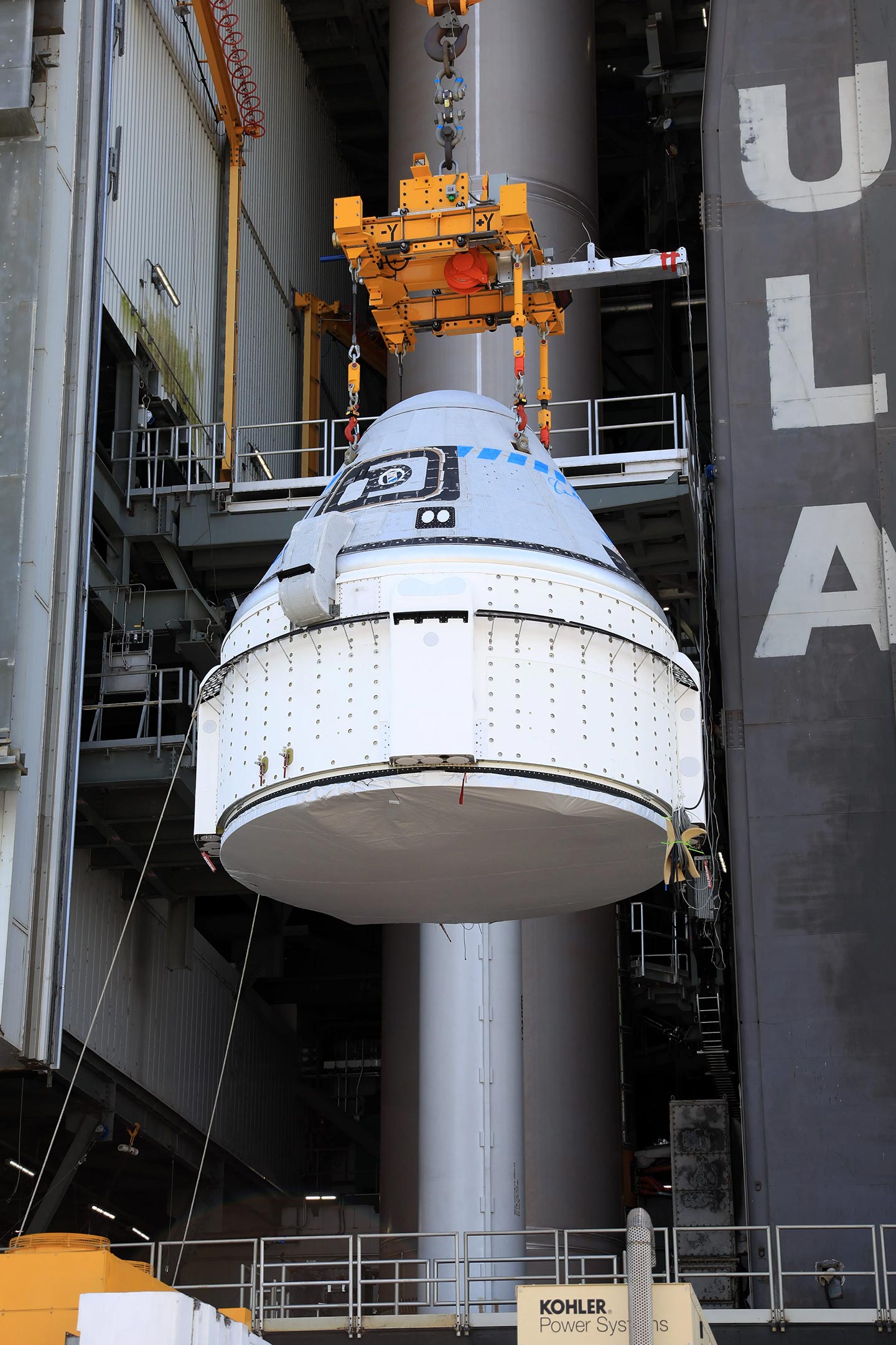 Boeing-CST-100-Starliner-Spacecraft-Lifted-Vertical-Integration-Facility.jpg