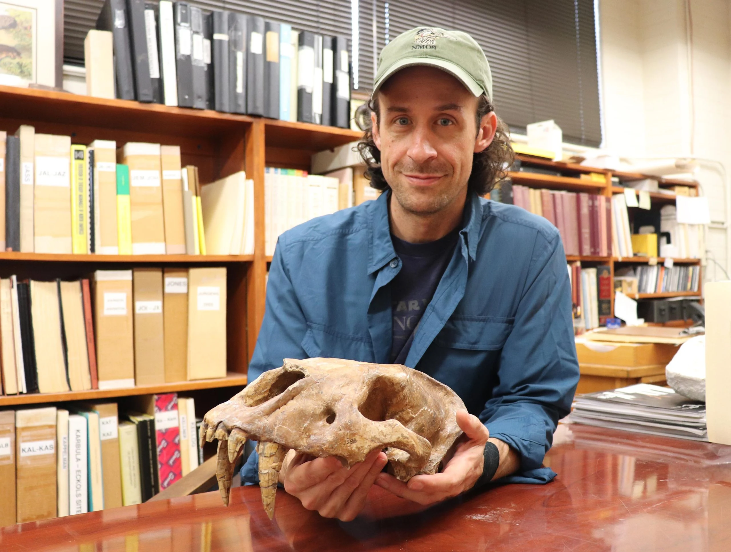 John-Moretti-Holding-Skull-scaled.webp