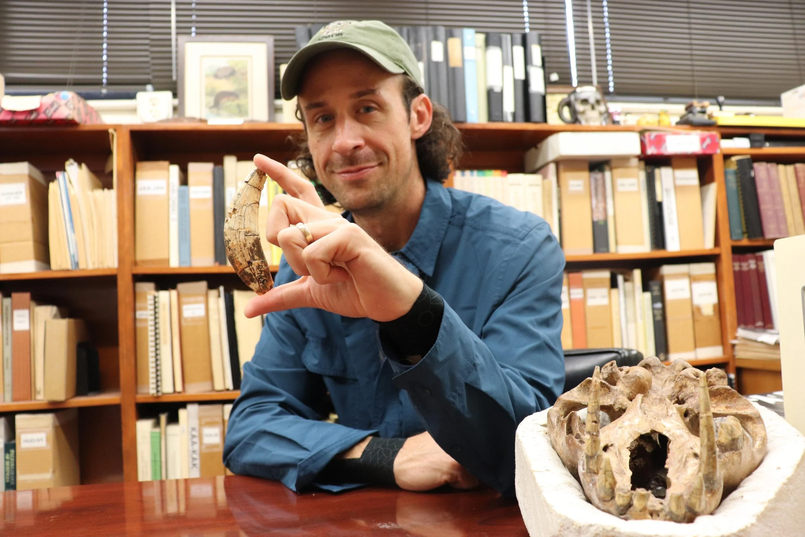 John-Moretti-Holding-Tooth-scaled.webp