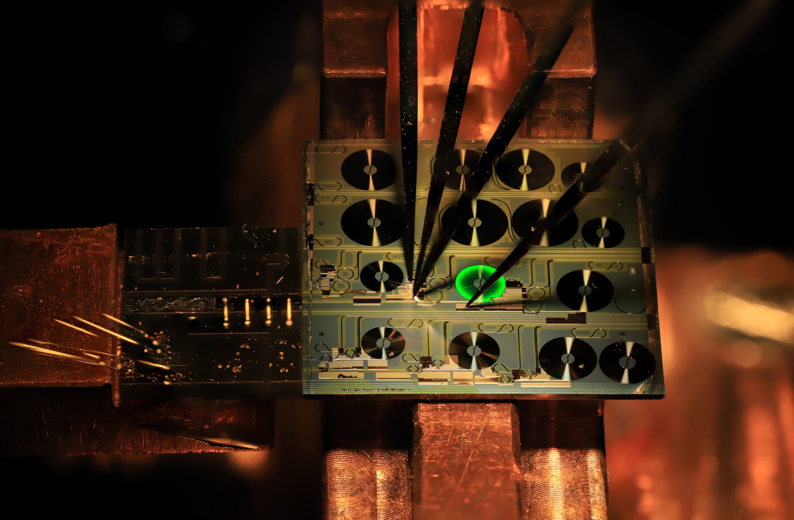 Optical-Image-of-a-Hybrid-Integrated-Erbium-Doped-Photonic-Integrated-Circuit-Based-Laser-scaled.jpg