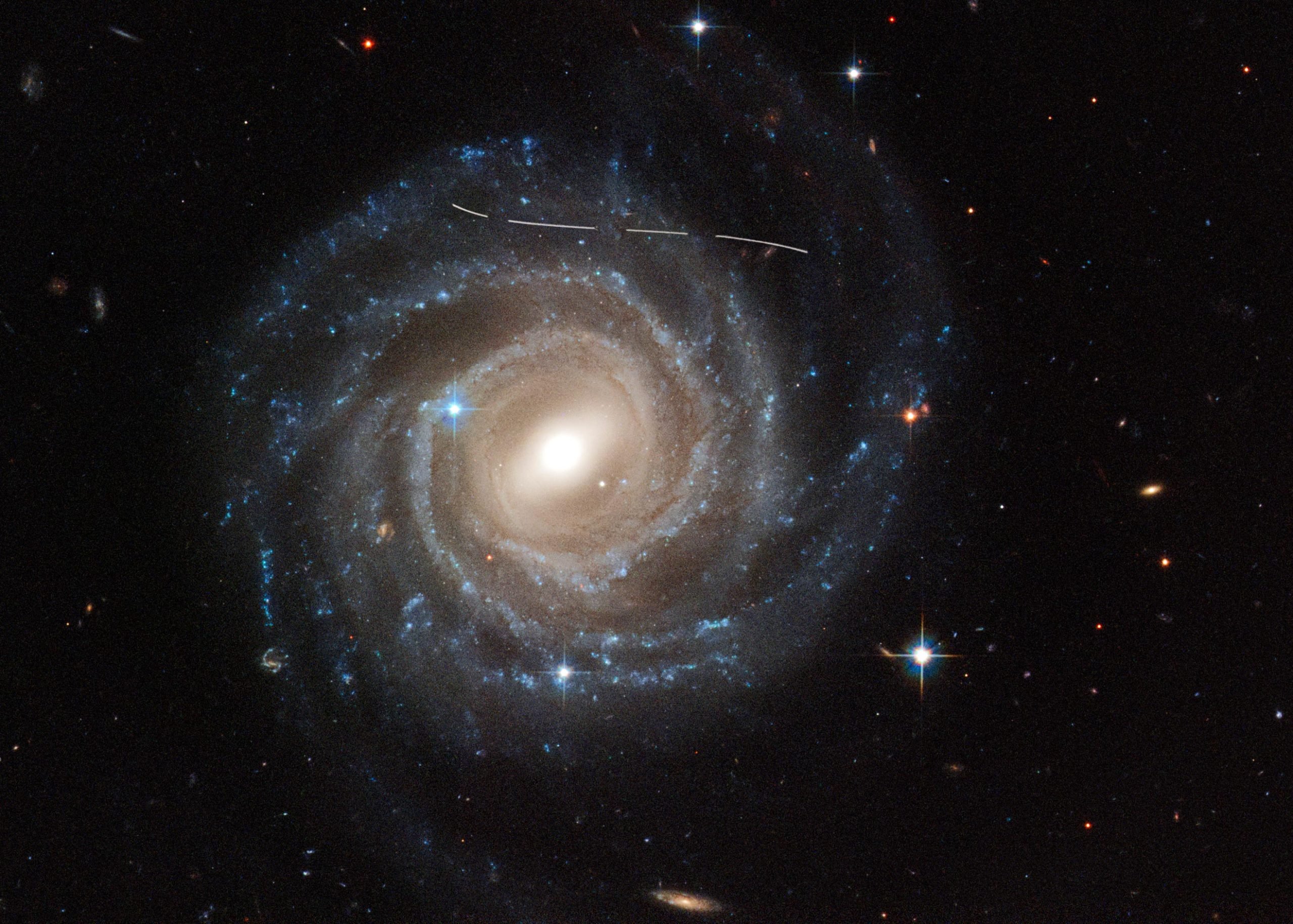 Wayward-Asteroid-Photobombs-Hubble-Snapshot-of-Galaxy-UGC-12158-scaled.jpg