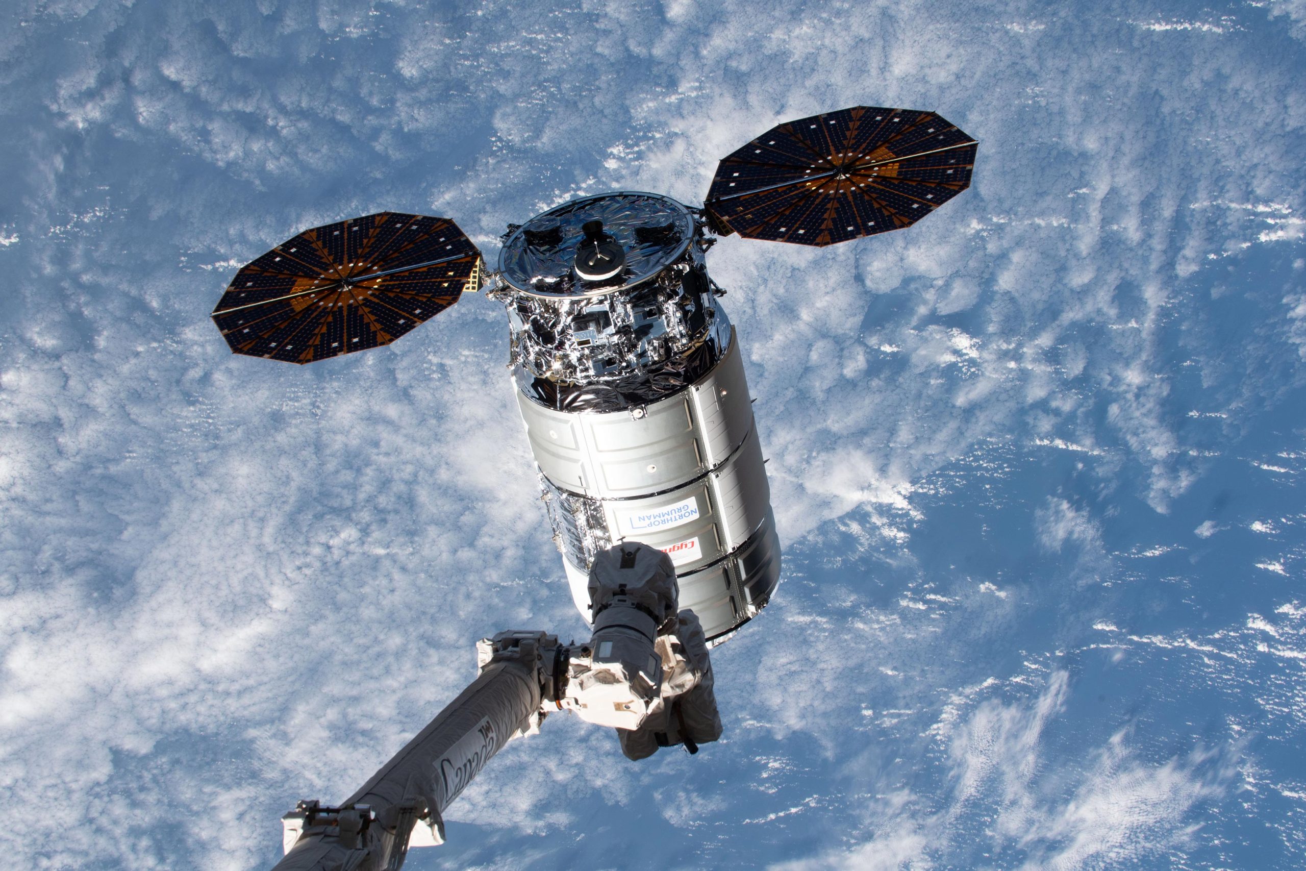 Canadarm2-Robotic-Arm-Reaches-Out-Toward-Cygnus-Space-Freighter-February-2024-scaled.jpg