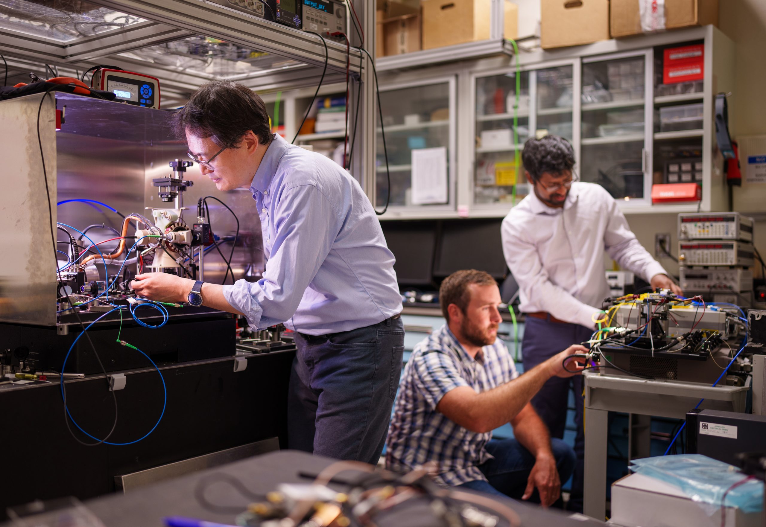 Jongmin-Lee-Ashok-Kodigala-and-Michael-Gehl-in-Photonics-Lab-scaled.jpg