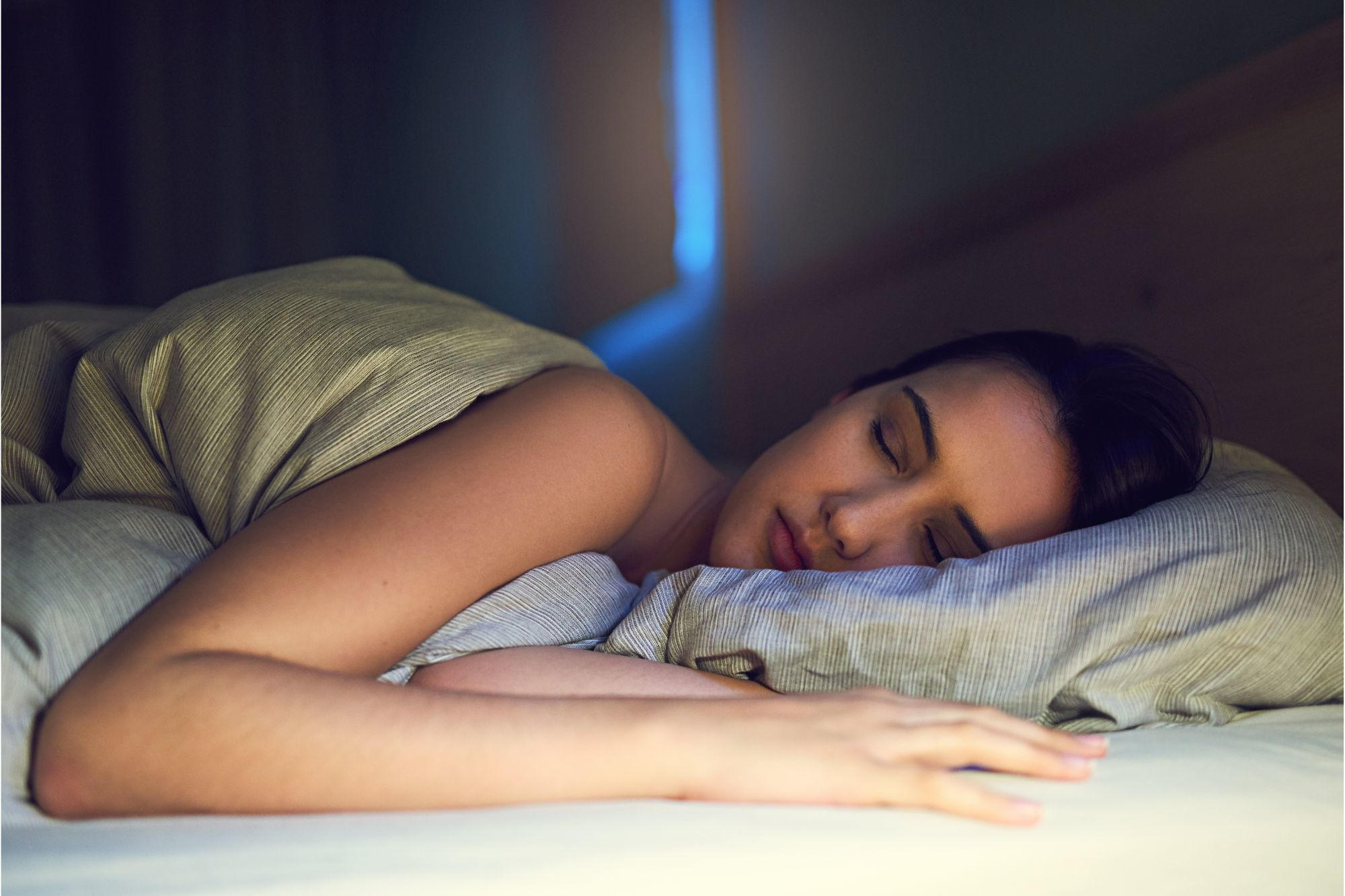 Woman-Sleeping-in-Bed-at-Night.jpg