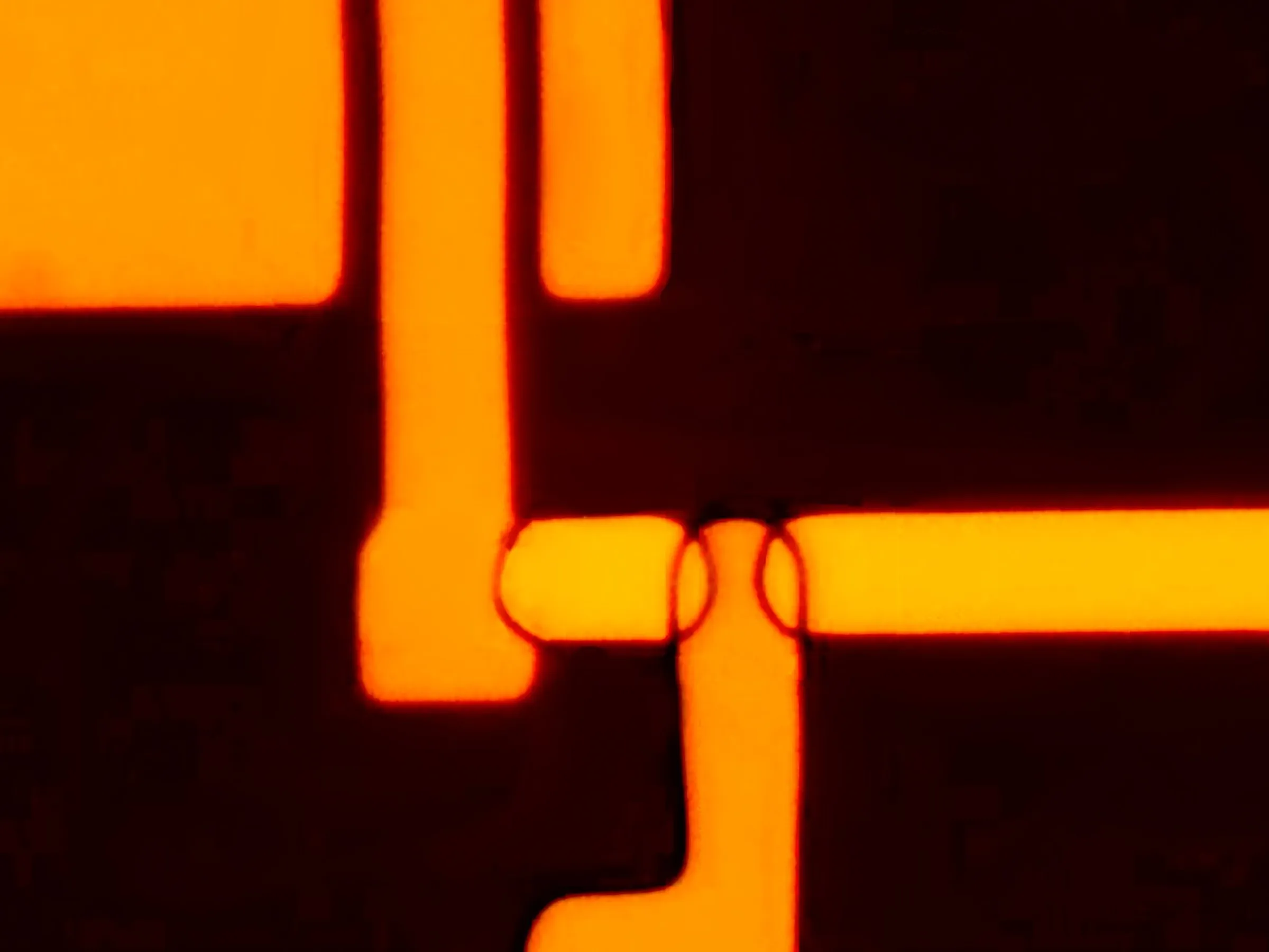 bright-orange-rounded-rectangles-overlapping-against-a-black-background.webp