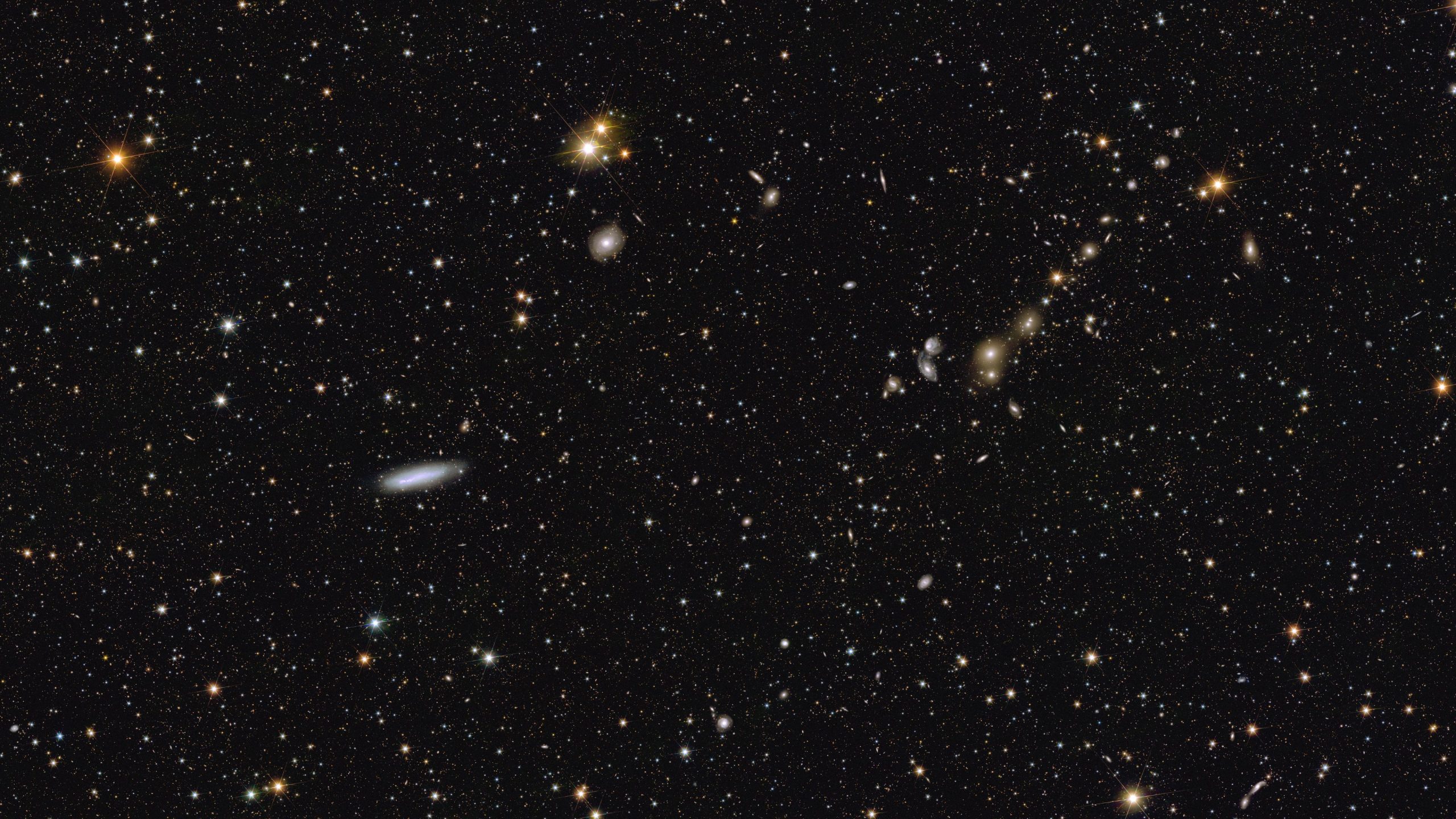 Euclid-Spiral-Galaxy-NGC-2188-and-Galaxy-Cluster-Abell-3381-scaled.jpg
