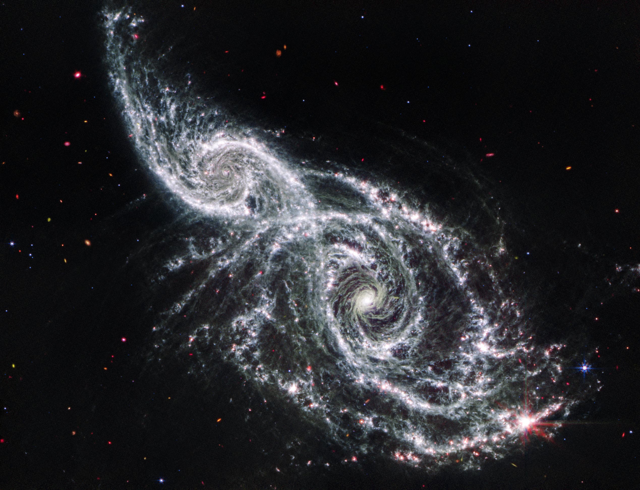 Galaxies-IC-2163-and-NGC-2207-Webb-MIRI-Image.jpg