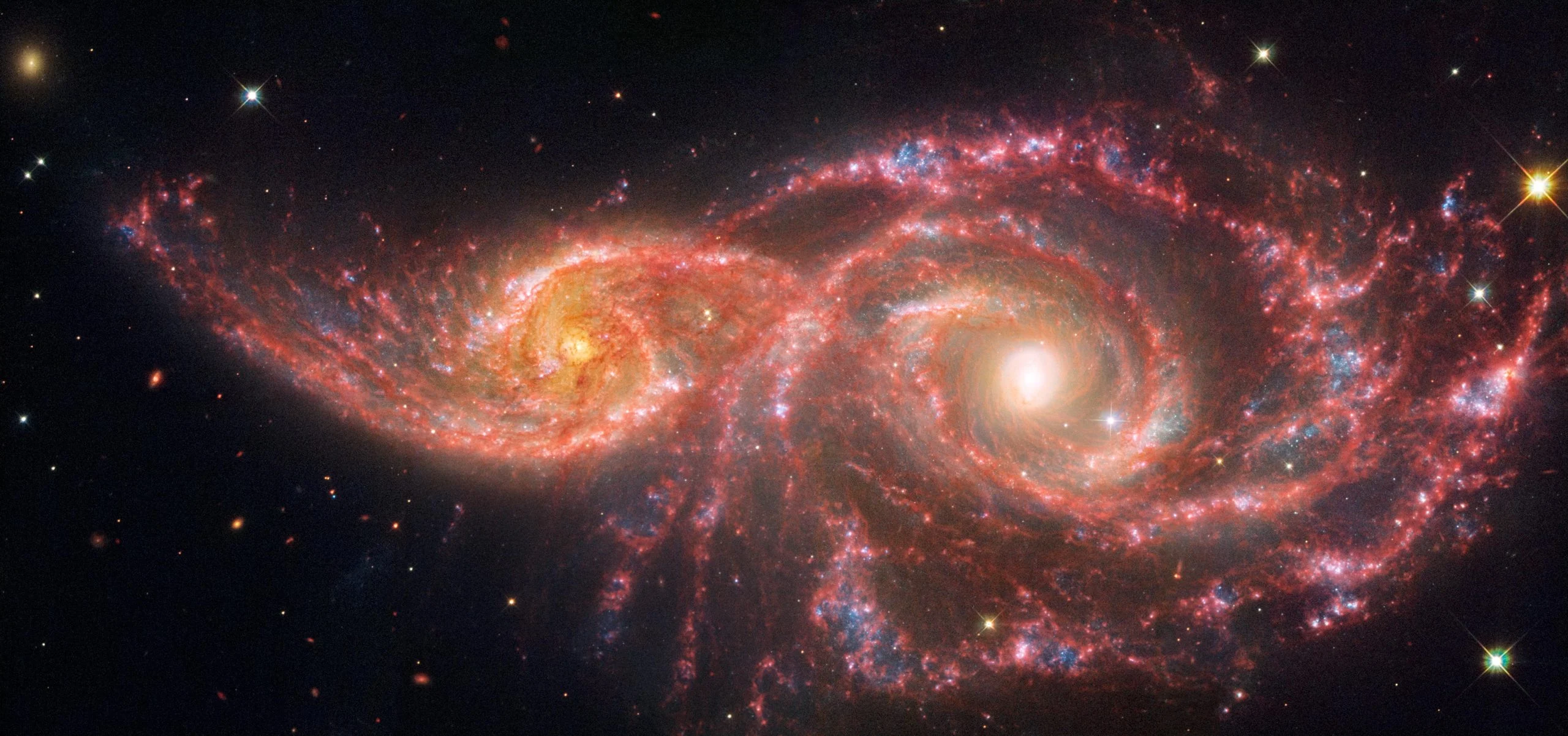 Galaxies-IC-2163-and-NGC-2207-Webb-and-Hubble-Image-scaled.jpg