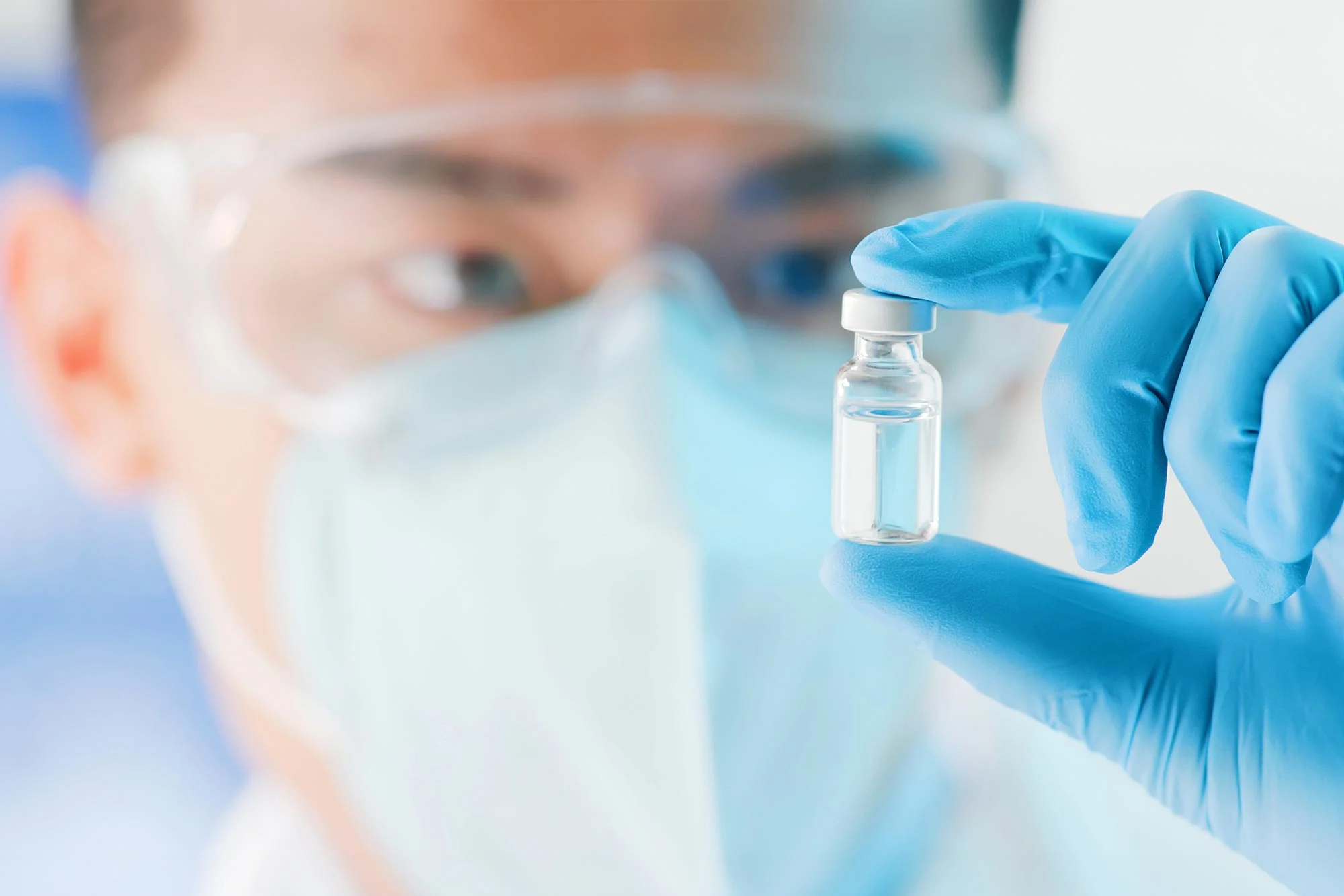 Medical-Researcher-Holding-Vaccine-Vial.jpg