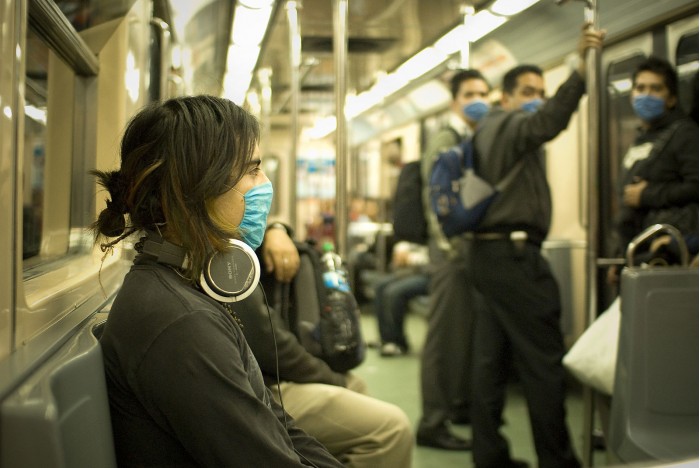 1599px-Swine_Flu_Masked_Train_Passengers_in_Mexico_City.jpg
