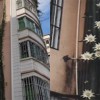 小区业主在楼外种植6层楼高量天尺