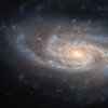 哈勃对NGC 3430的快照展示宇宙螺旋的精彩细节