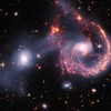 看见宇宙的微笑：韦伯望远镜新红外图像展示星系合并引发的恒星形成