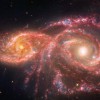 NASA揭示IC 2163和NGC 2207星系：来自深空的“红眼睛”